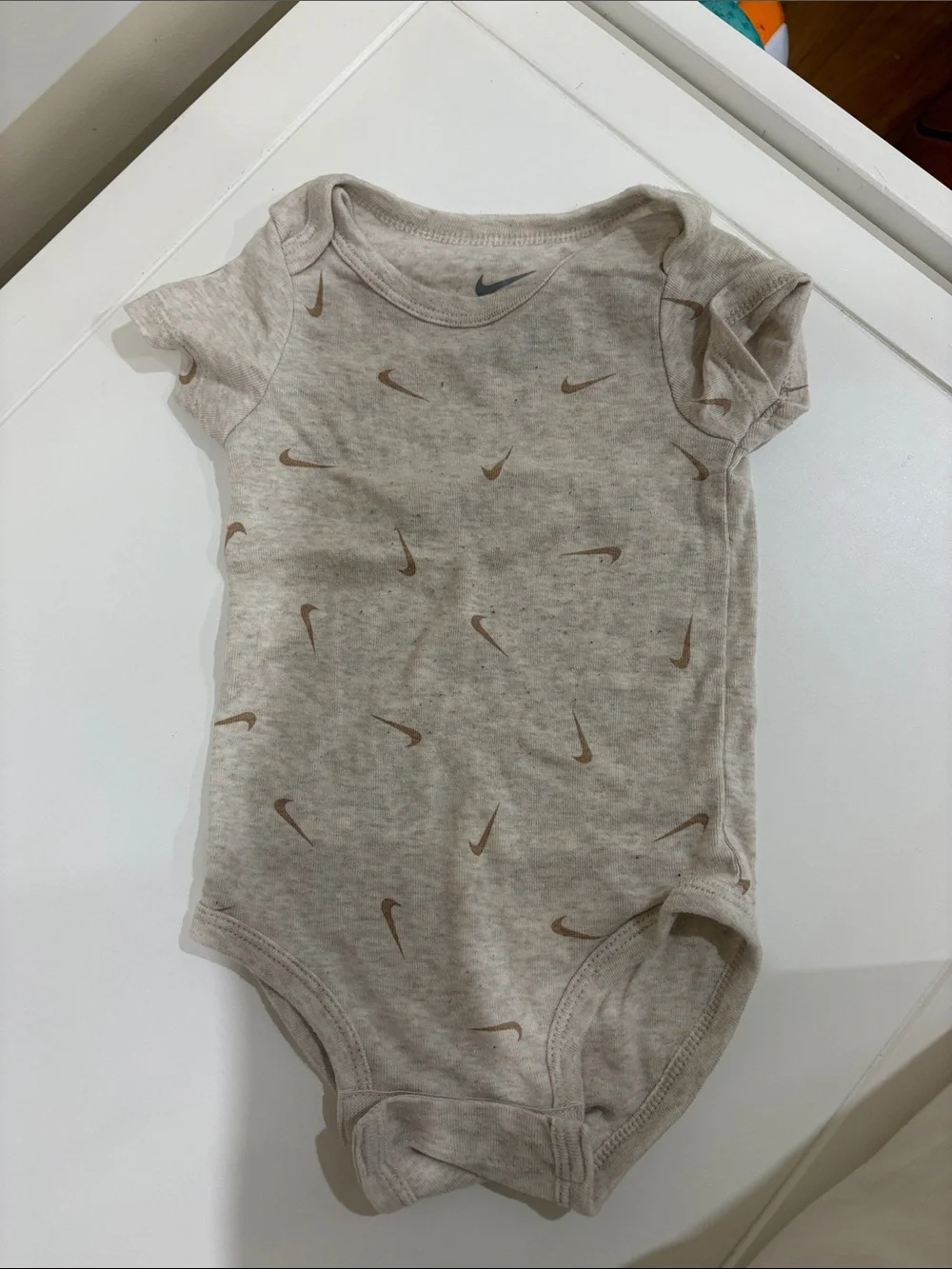Nike Light Beige Baby One-Piece Bodysuit with Brown Swoosh Print